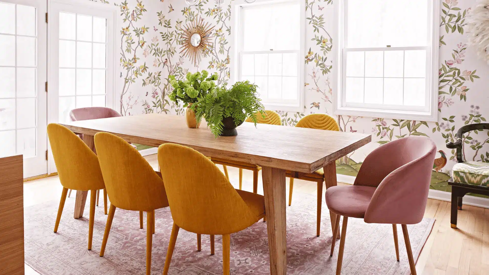 Simple wooden dining table with classic chairs in cozy dining area