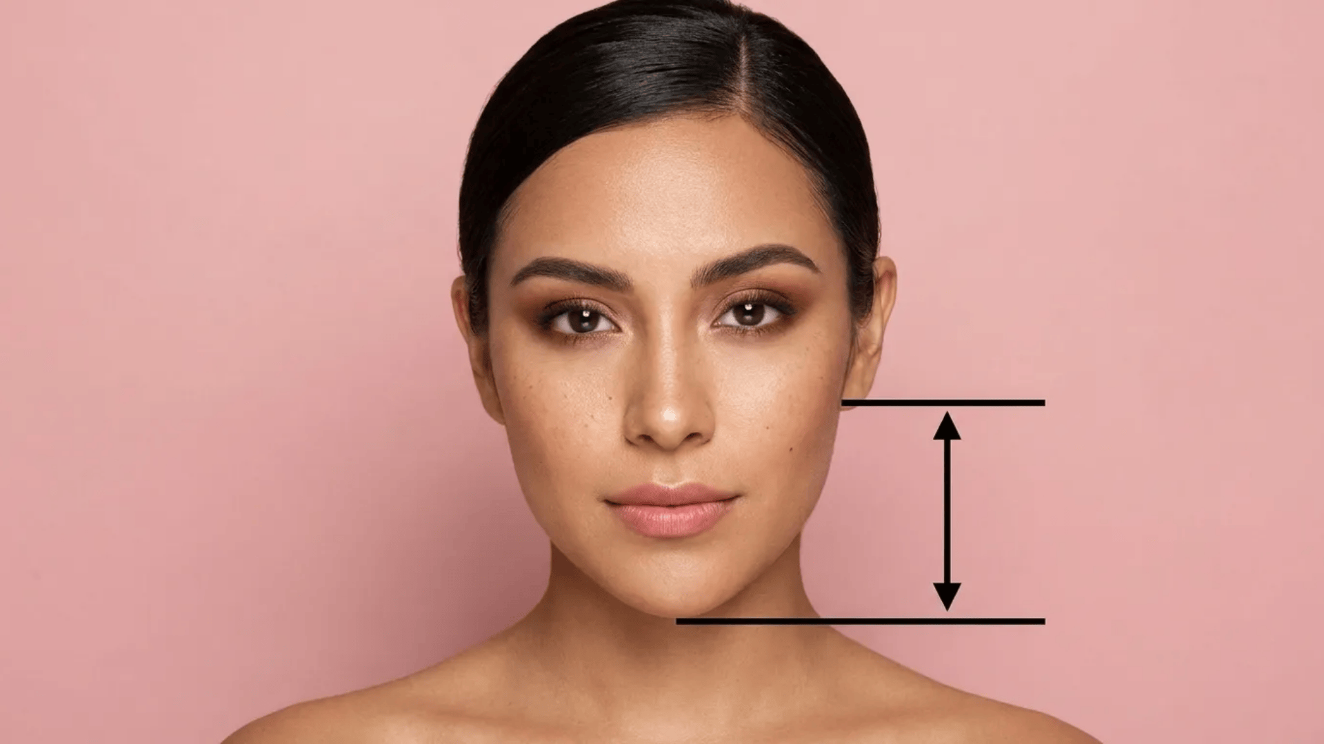 Front-facing woman with guide lines measuring distance from ear level to chin.