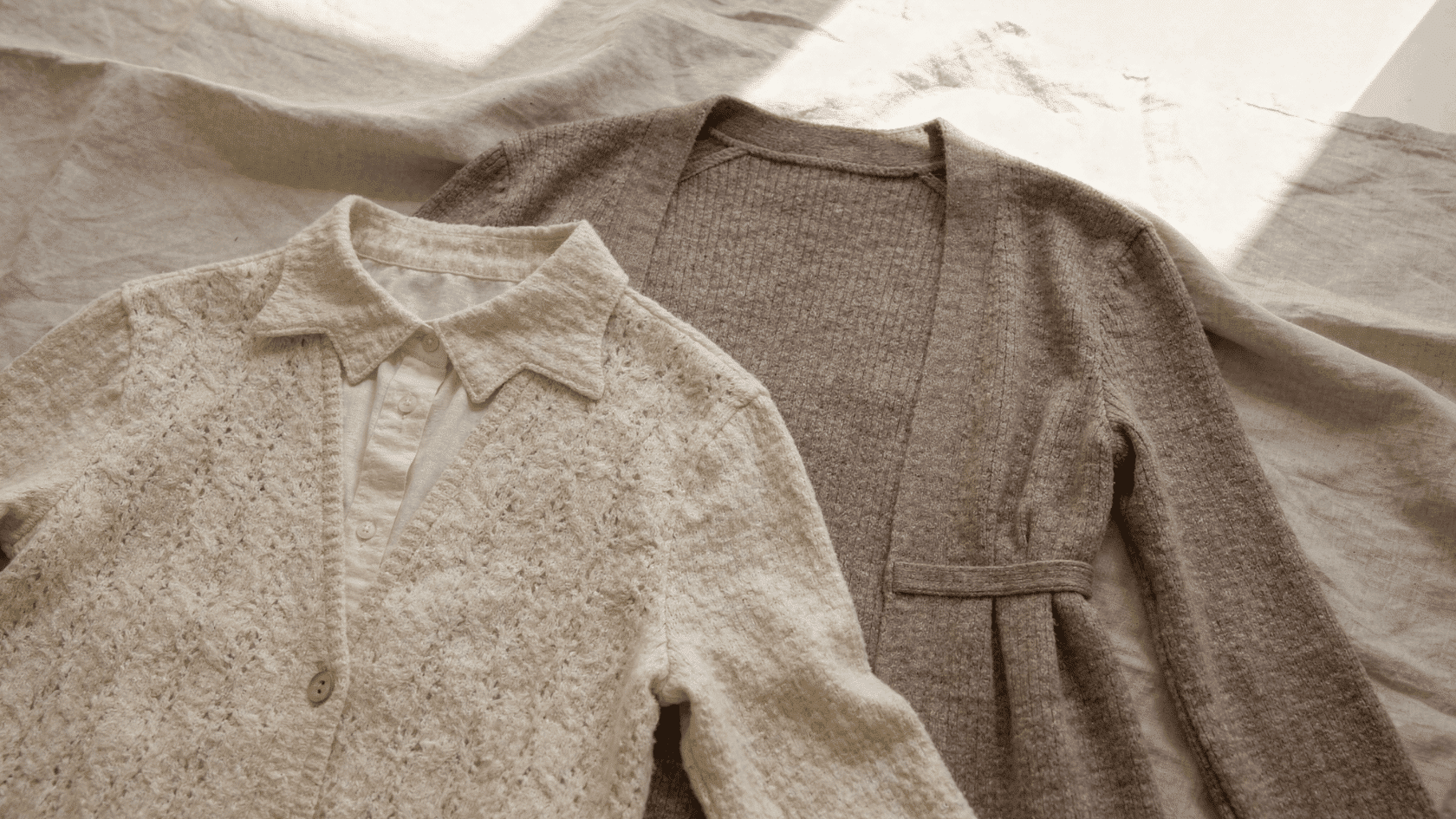 Linen and knit fabric pieces arranged flat on a neutral background showing soft texture