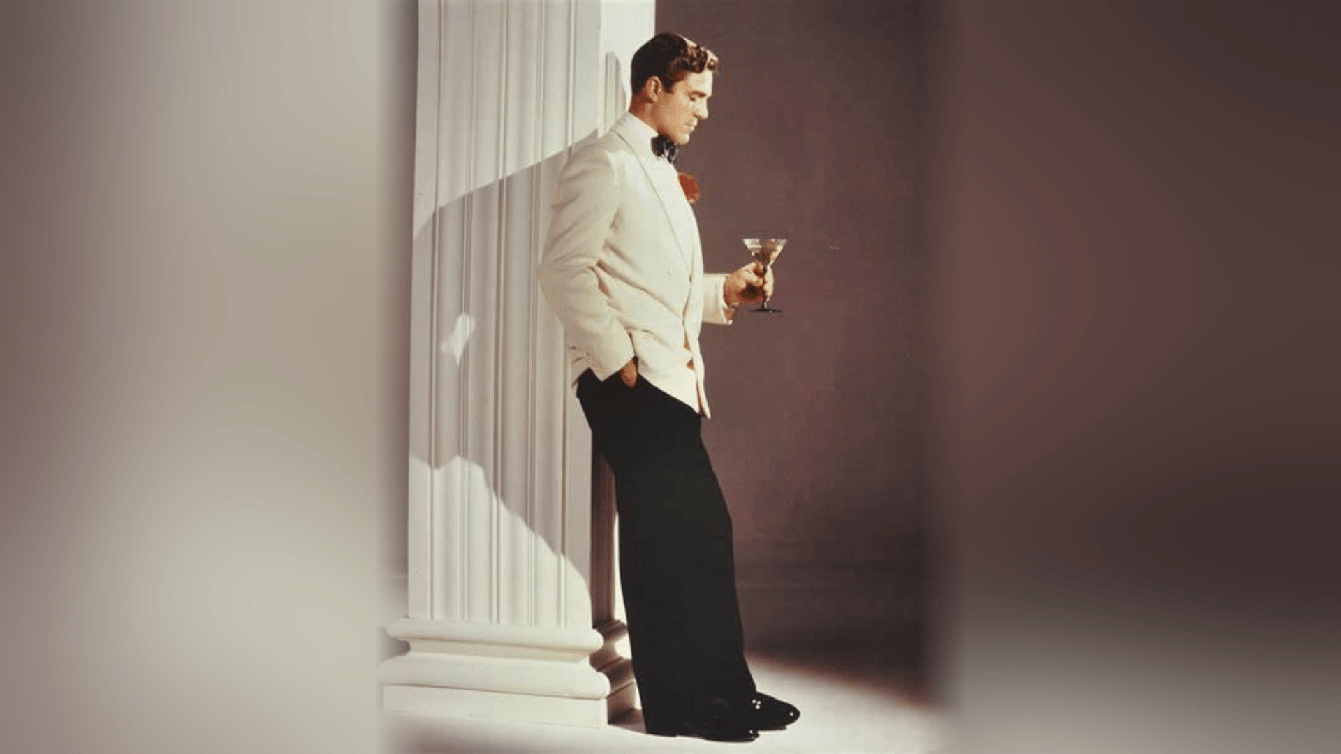 White dinner jacket with a black bow tie, a classic men's old Hollywood outfit
