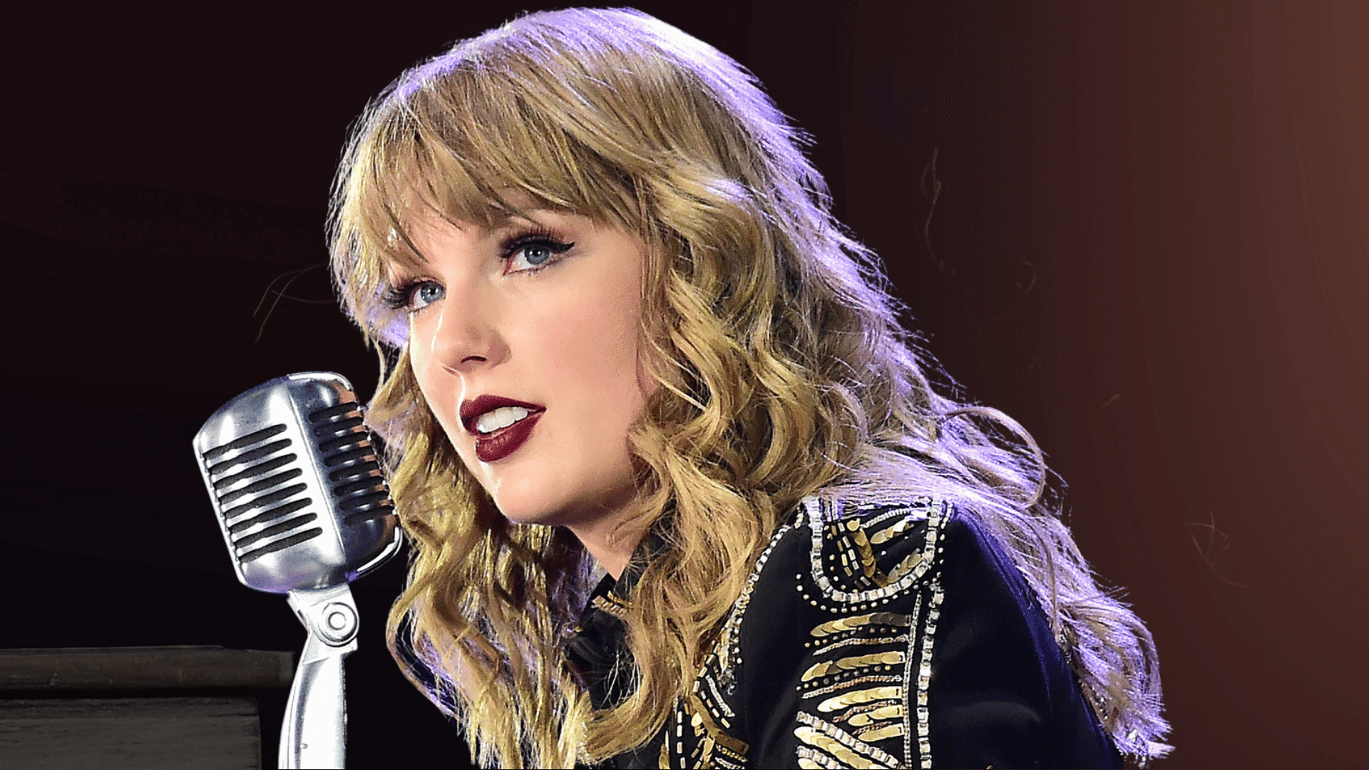 Taylor Swift posing in a colorful striped sequin outfit with curly hair