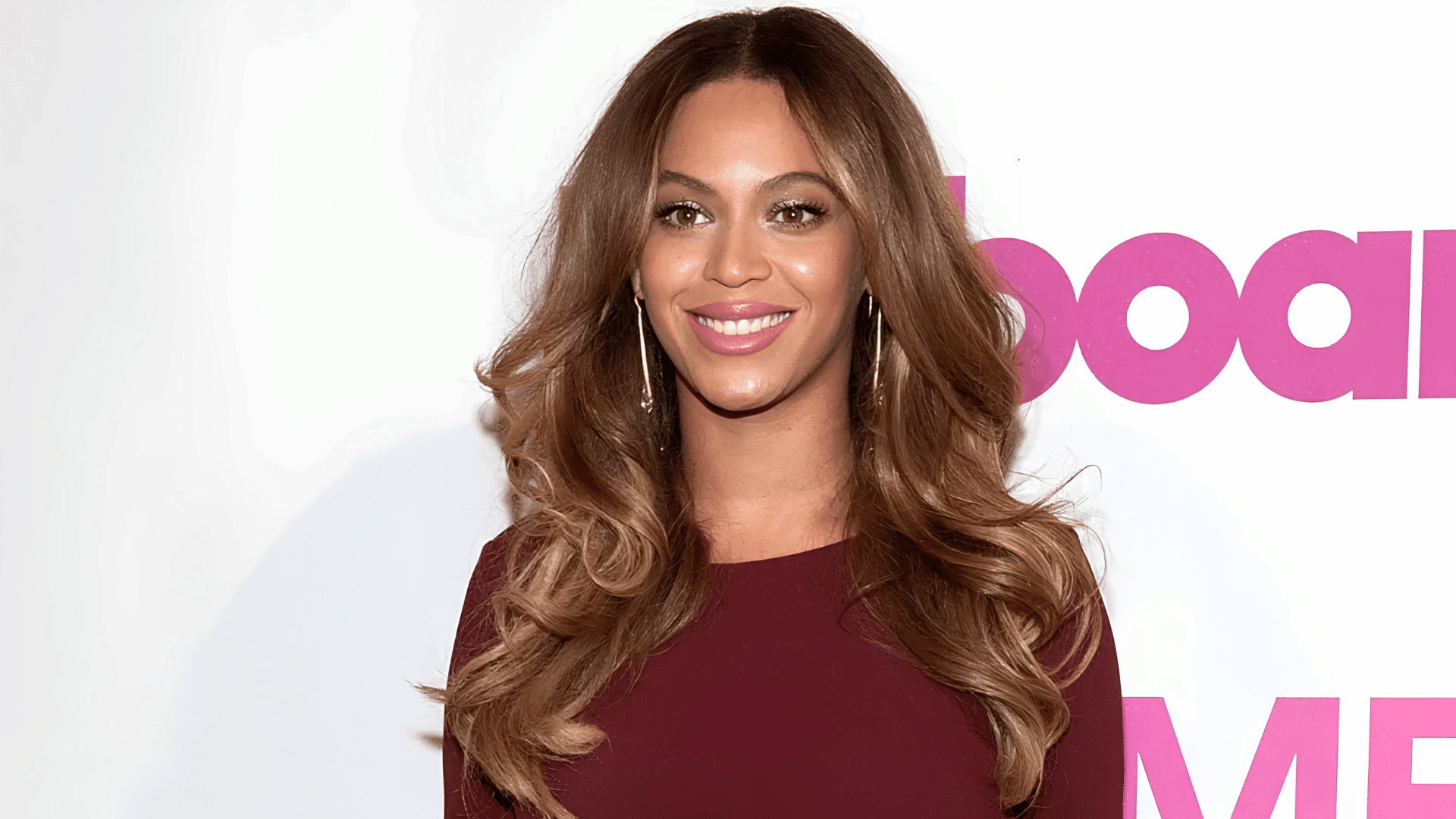 Beyonce with long layers framing her heart-shaped face.