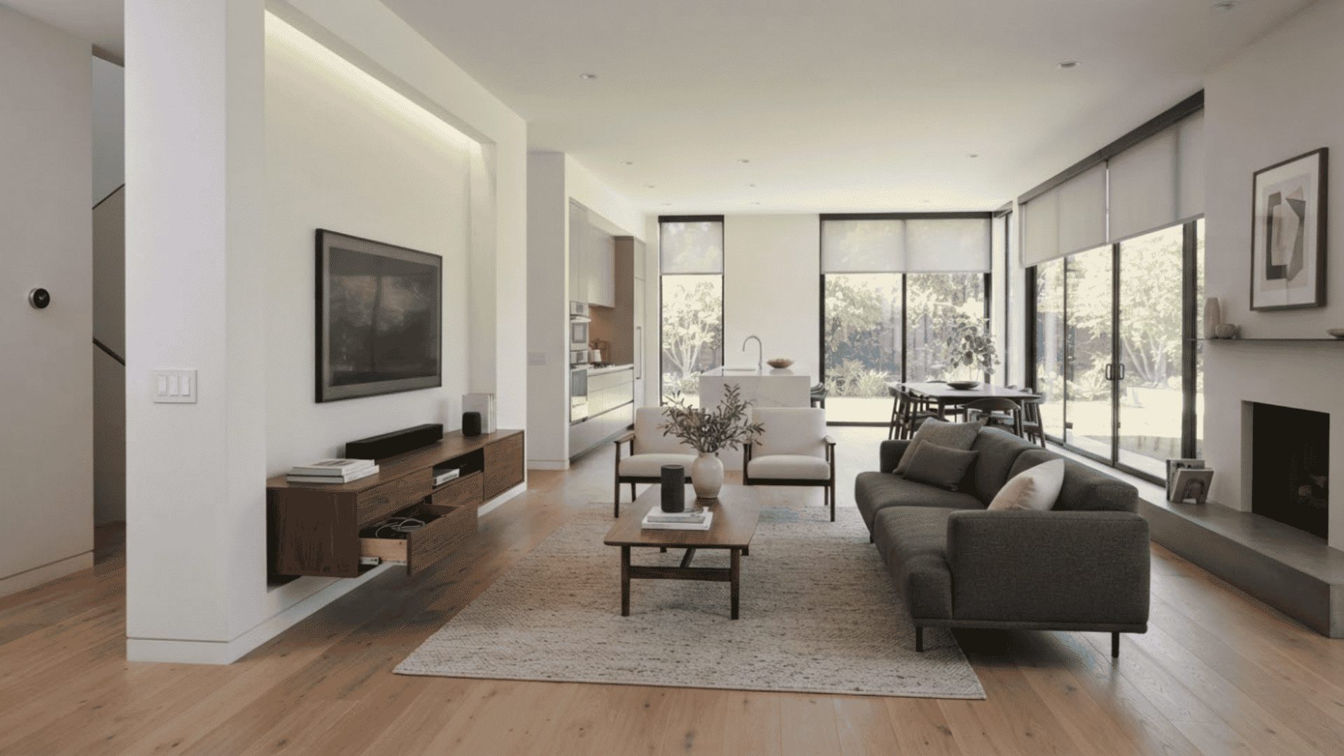 Contemporary home interior with smart devices, automated lighting, and minimalist features creating a functional modern space.