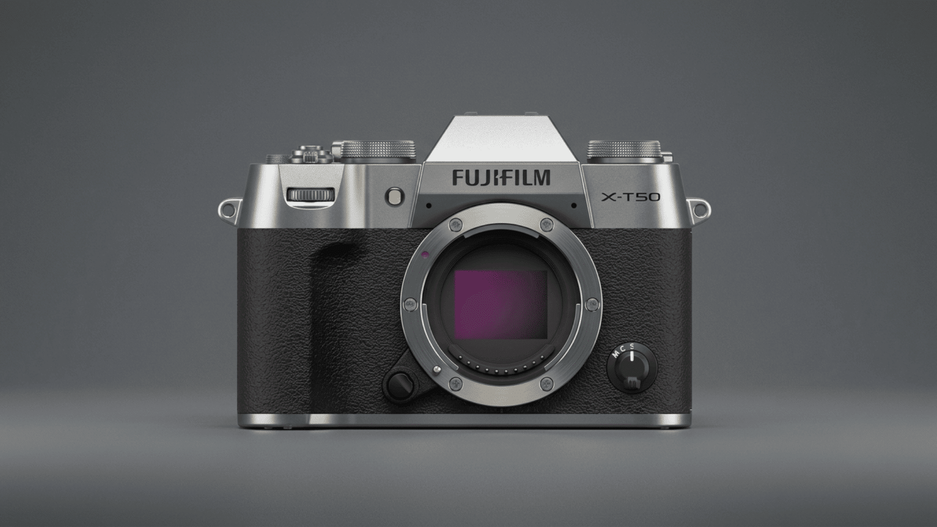 Fujifilm X-T50 mirrorless camera body with interchangeable lens mount on a gray background.