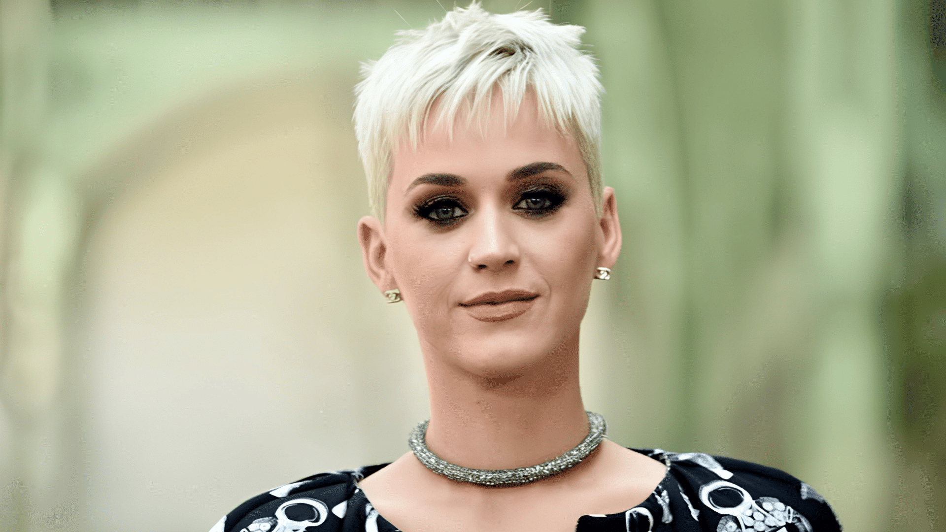 Katy Perry with a shaggy pixie haircut on a heart-shaped face.