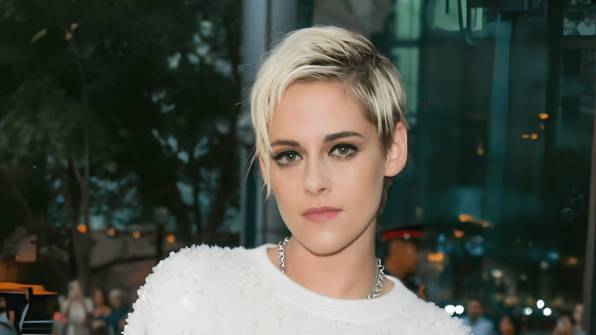 Kristen Stewart with a pixie cut and side fringe on a heart-shaped face.