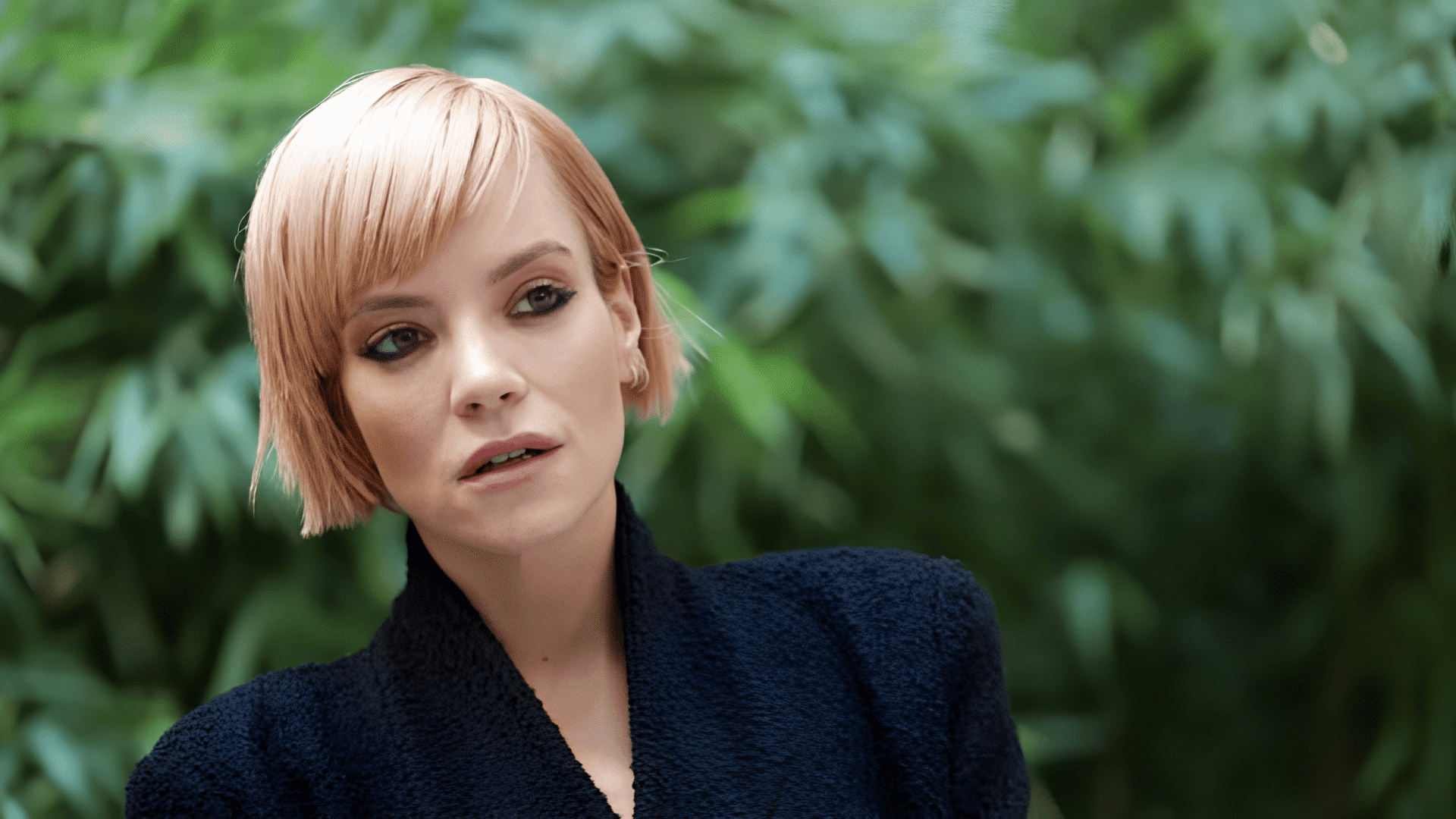 Lily Allen with a choppy bob haircut on a heart-shaped face.