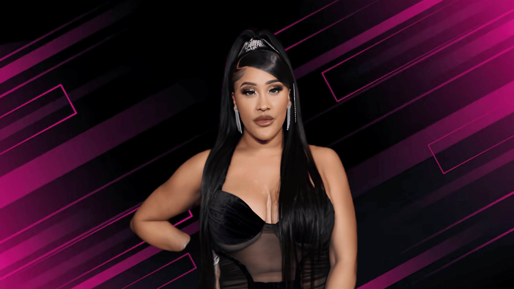 Natalie Nunn with long black hair wearing a black outfit posing against a purple and black abstract background.