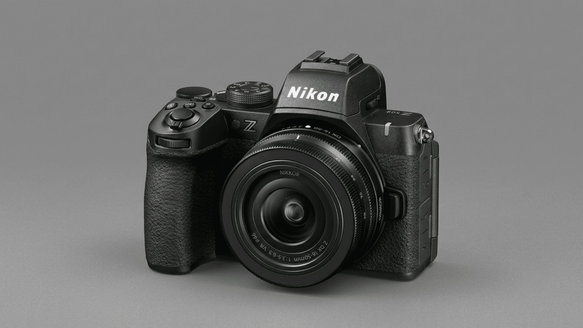 Nikon Z50II mirrorless camera with attached lens displayed on a gray background.
