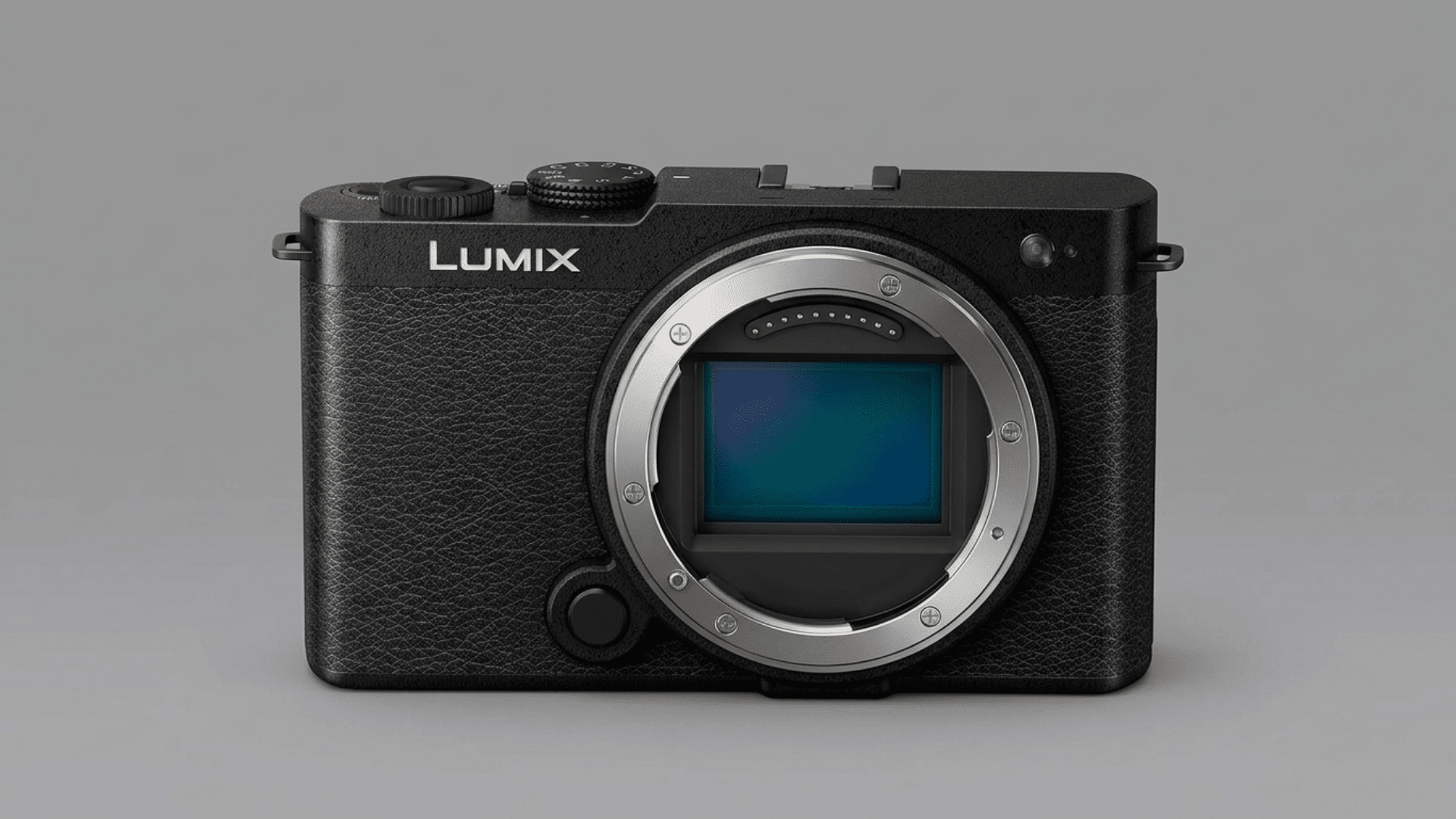 Panasonic Lumix S9 mirrorless camera body with exposed sensor on a gray background.