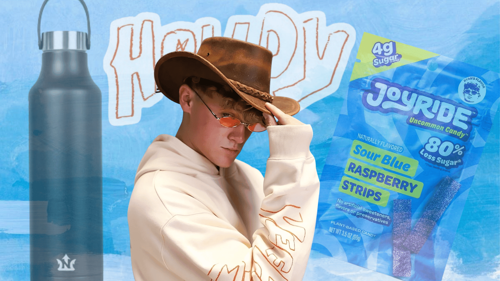 Ryan Trahan wearing a hat and sunglasses beside a candy package and bottle on a blue graphic background.