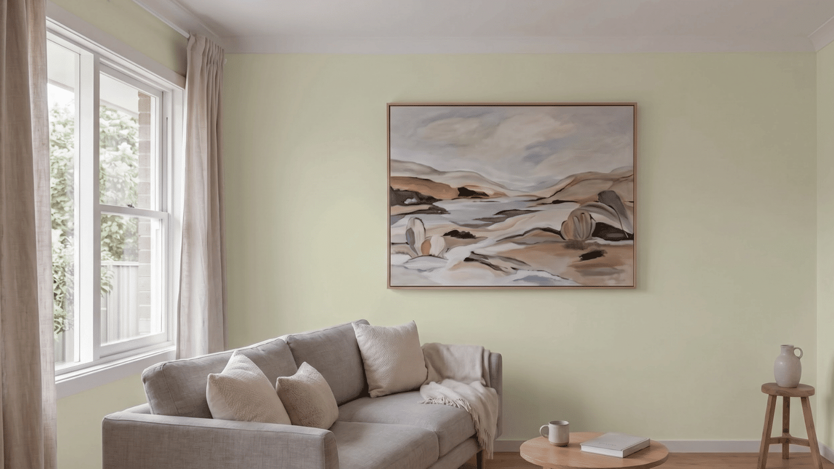 Small living room with a single large artwork as the main focal point on the wall