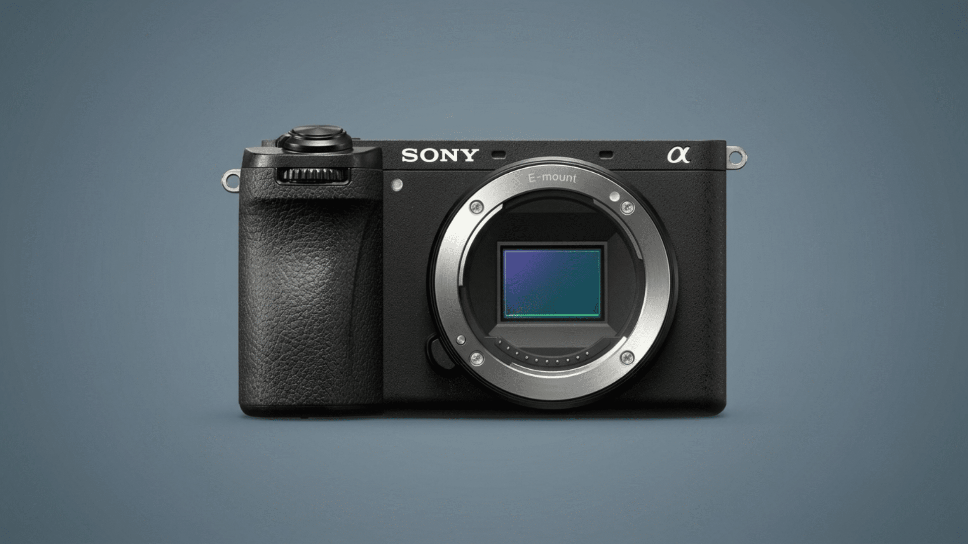 Sony a6700 mirrorless camera body with exposed E-mount and sensor on a blue background.