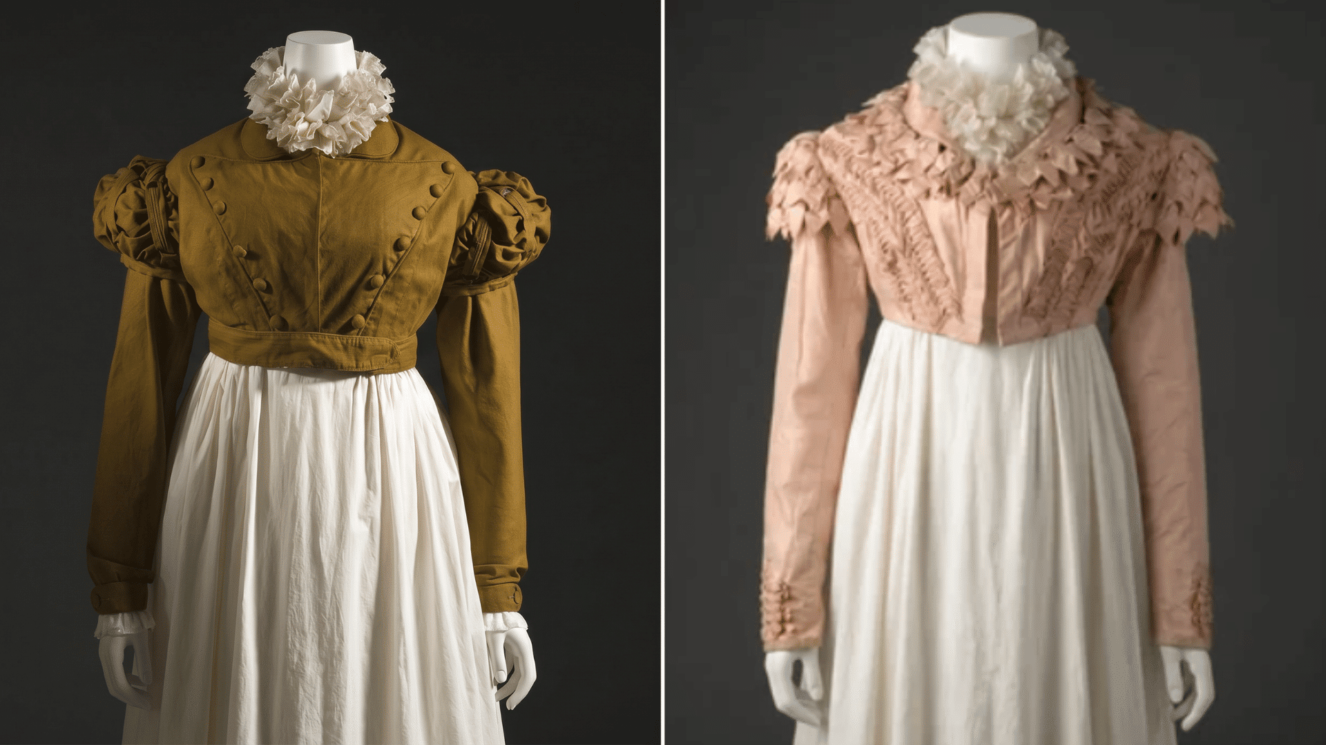 Two Regency era Spencer jackets on mannequins, one in olive wool with puff sleeves and one in blush silk with ruffled trim.