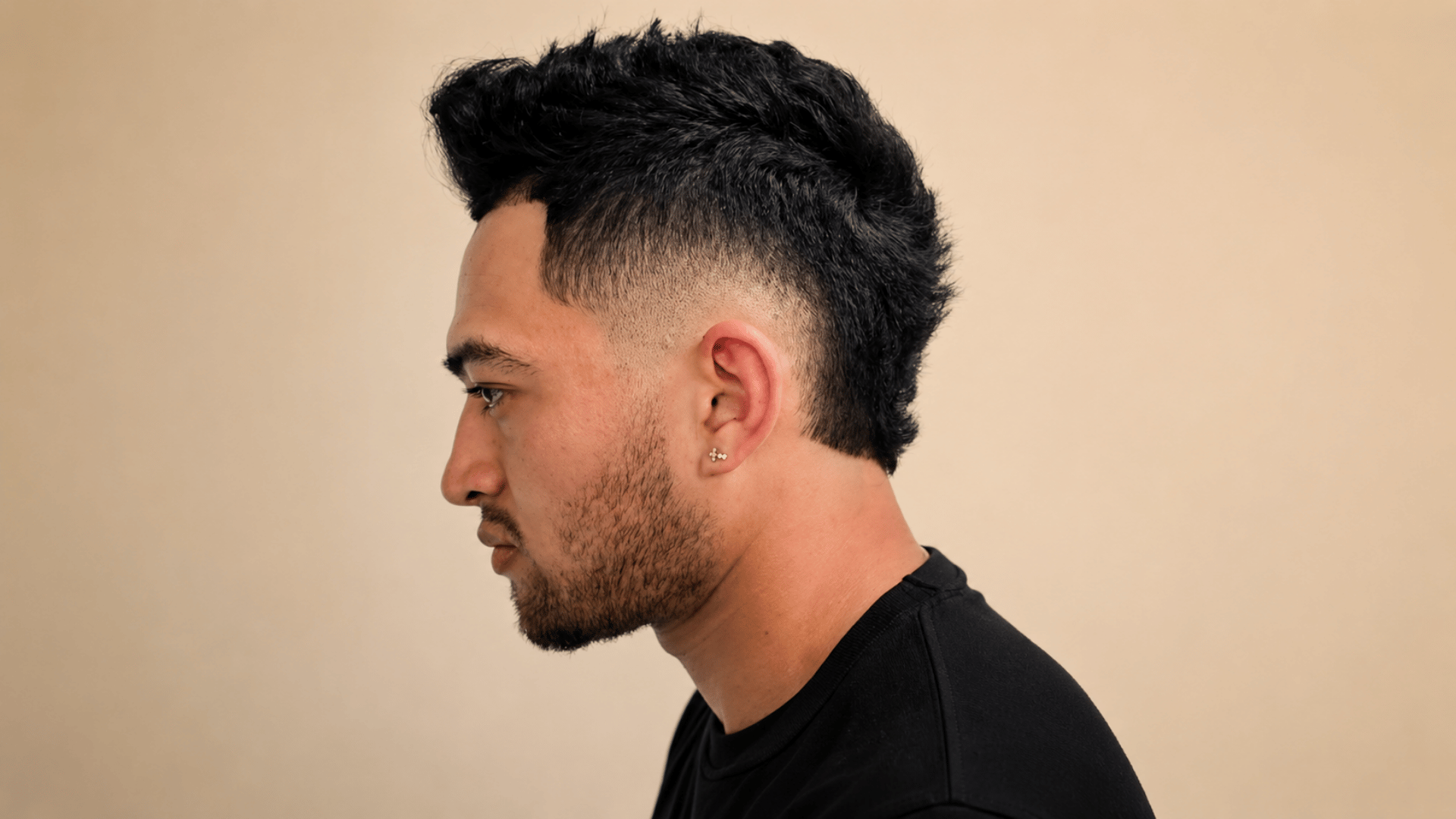 Mohawk fade with tapered sides and raised center strip showing one of the types of mohawks for men