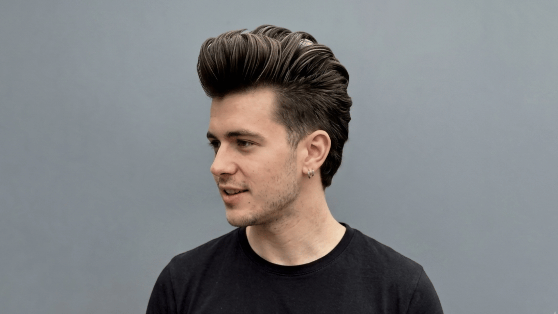 pompadour mohawk with swept-back height and defined center strip showing one of the types of mohawks styles