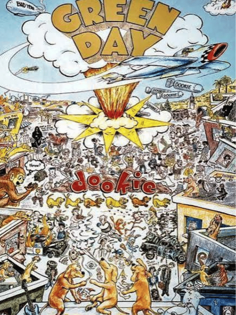 Green Day โ Dookie album cover featuring chaotic cartoon artwork with explosions, planes, and figures.