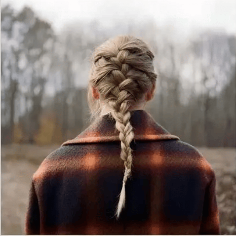 Taylor Swift with braided hair on the Evermore cover, a folk-inspired contender for the best Taylor Swift album.