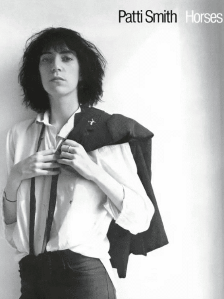 Patti Smith โ Horses album cover featuring a black-and-white portrait with a white shirt and jacket.