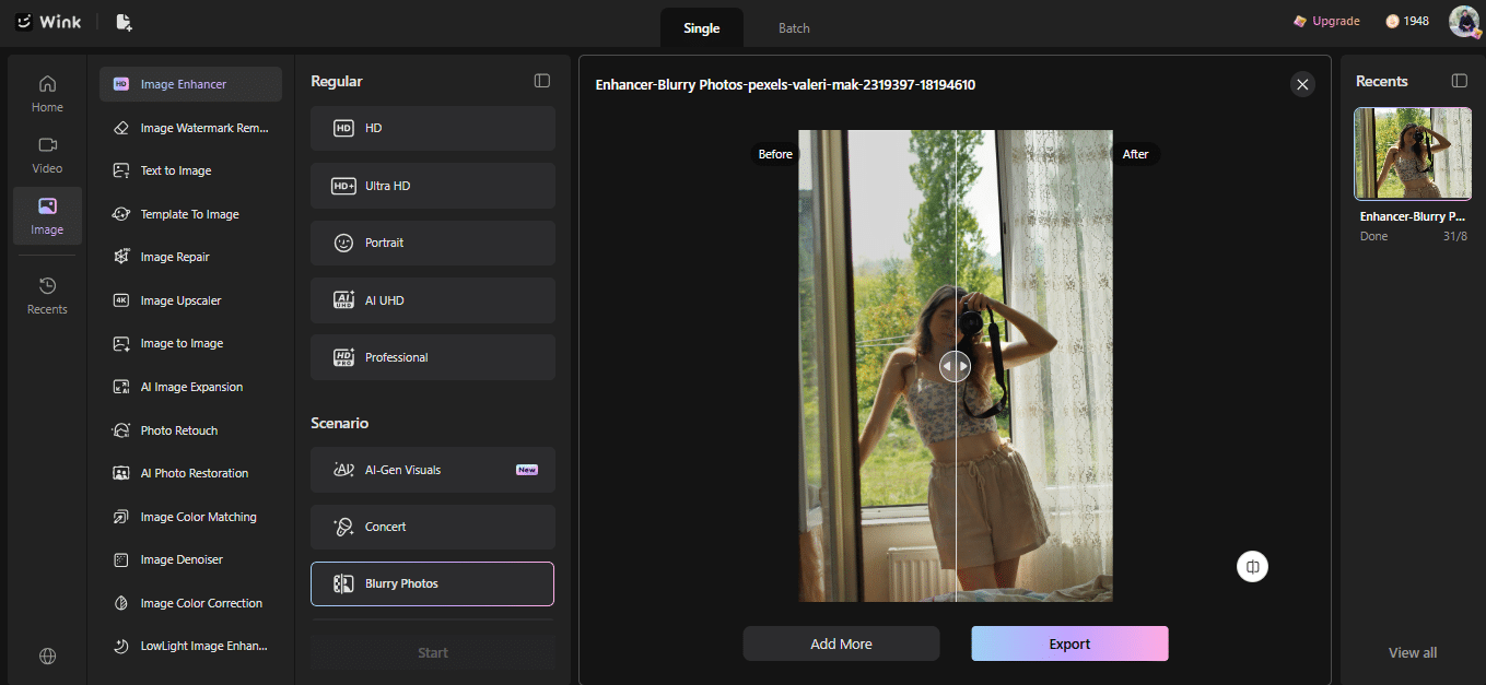Person in floral crop top holding camera in front of lace-curtained window