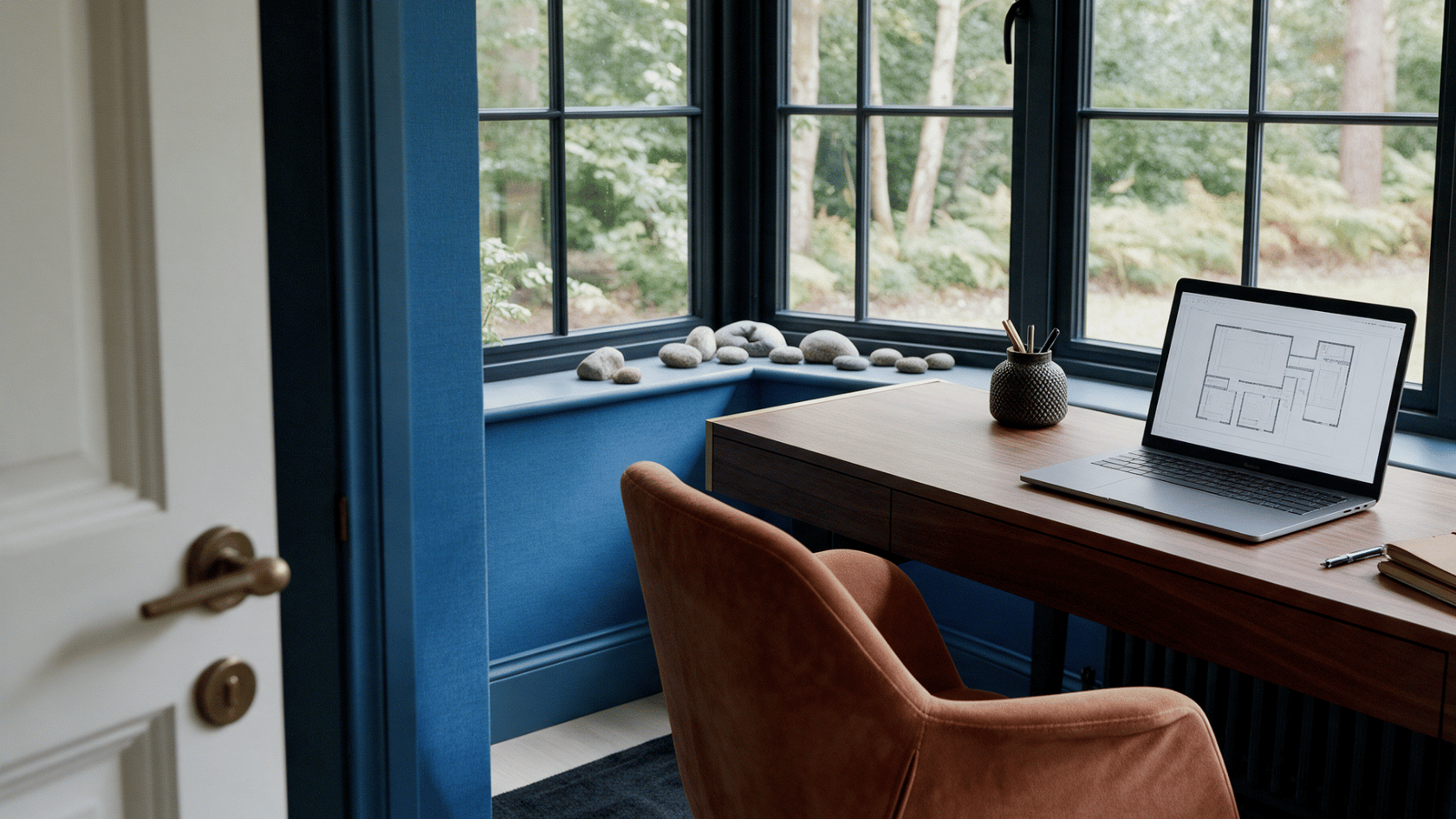 Desk positioned away from direct door alignment with windows, natural light, and balanced office layout.