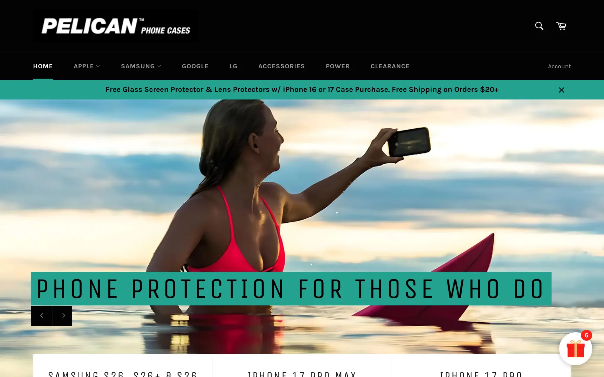 Woman in pink swimsuit taking selfie on surfboard in the ocean during sunset