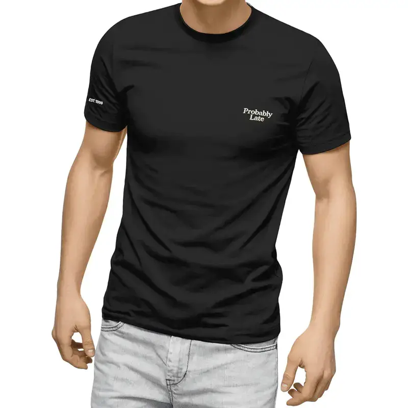 Man wearing a black "Probably Late" t-shirt with light gray jeans in a studio setting